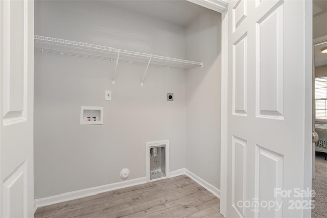 laundry room with gas dryer hookup, hookup for a washing machine, hookup for an electric dryer, and light wood-type flooring