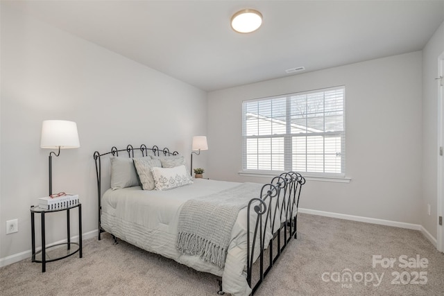 bedroom featuring light carpet