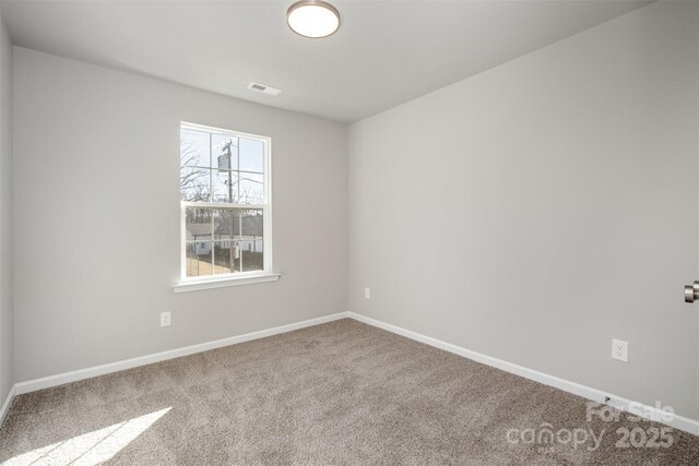 spare room featuring carpet floors