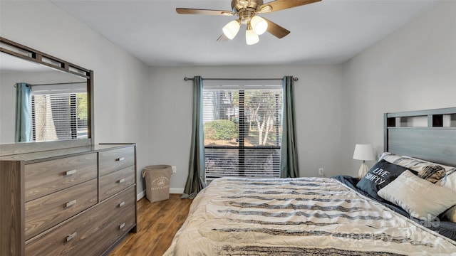 bedroom with ceiling fan, light hardwood / wood-style floors, and multiple windows