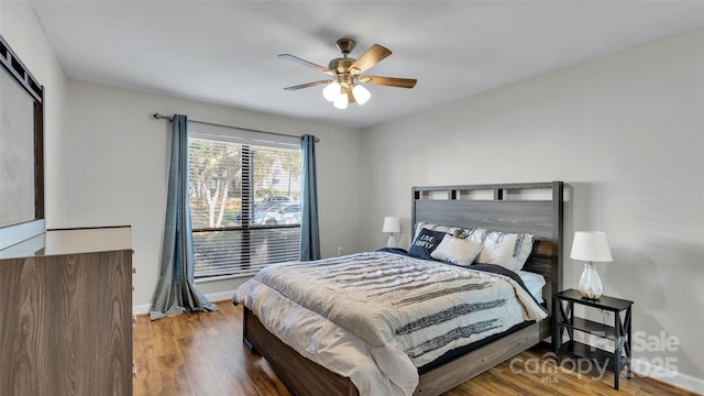 bedroom featuring ceiling fan and hardwood / wood-style floors