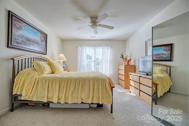 bedroom with ceiling fan and carpet