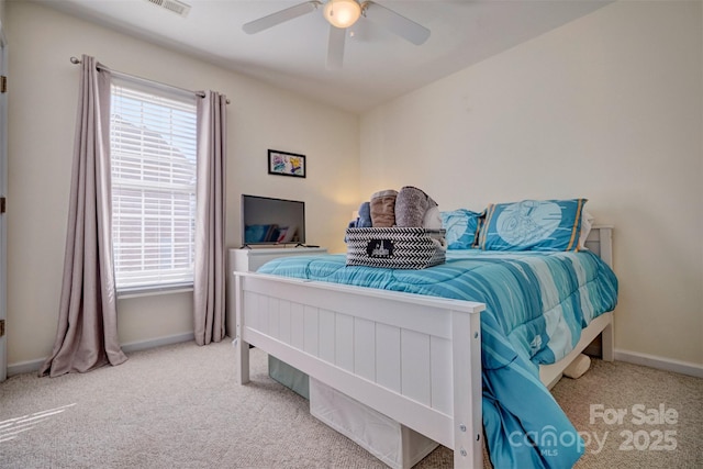 bedroom featuring multiple windows, carpet floors, and ceiling fan