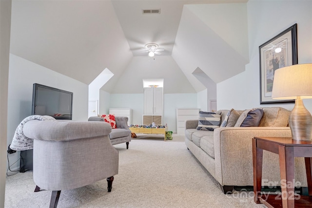 living room featuring lofted ceiling, light colored carpet, and ceiling fan