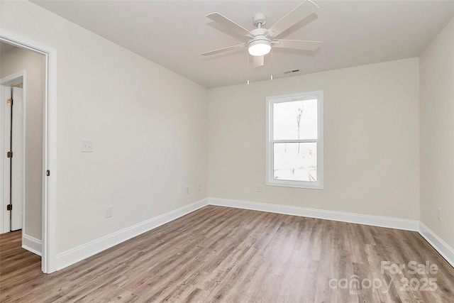 empty room featuring light hardwood / wood-style floors and ceiling fan