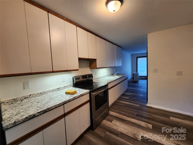 kitchen featuring white cabinetry, electric range, dark hardwood / wood-style floors, light stone counters, and a textured ceiling