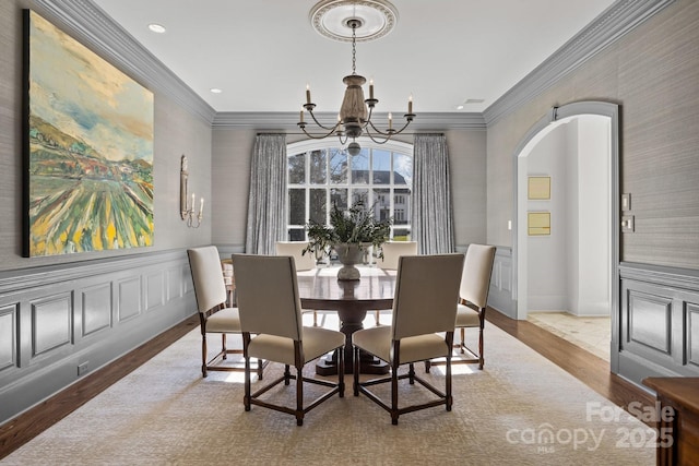 dining space featuring a notable chandelier and wood-type flooring