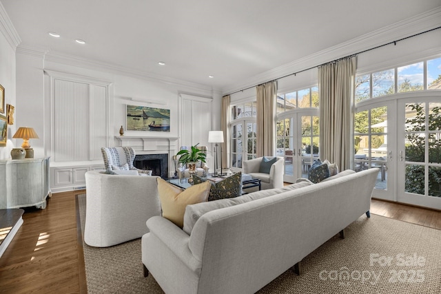 living room with french doors, crown molding, and dark wood-type flooring