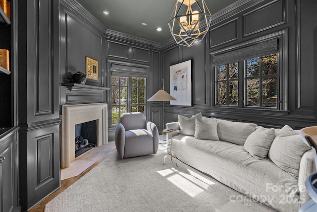 living room featuring a notable chandelier and ornamental molding