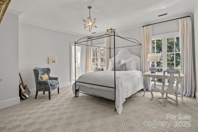 bedroom with crown molding, light carpet, and a chandelier