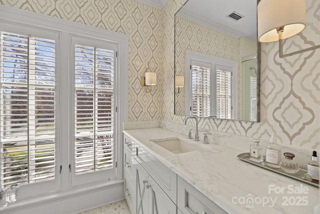 bathroom featuring vanity and ornamental molding