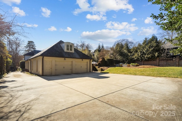 view of side of home with a yard