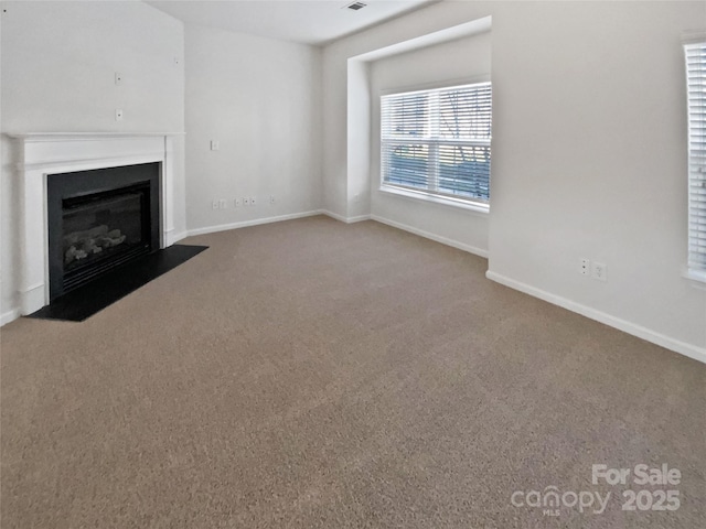 unfurnished living room with carpet floors