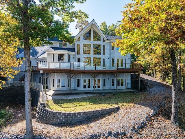 back of house with a patio and a deck