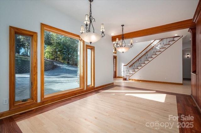 unfurnished dining area featuring light hardwood / wood-style floors