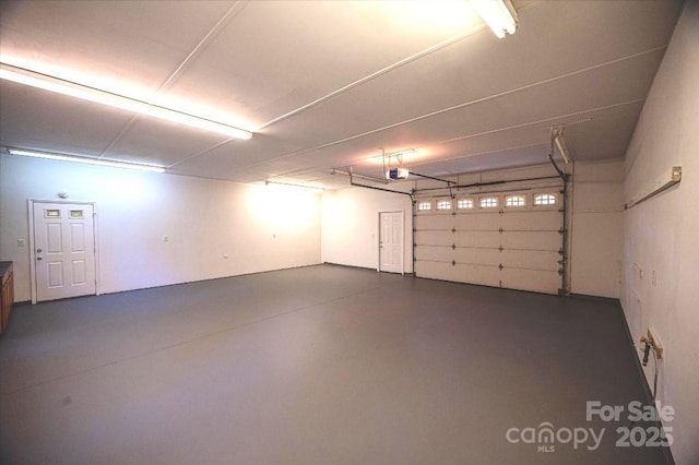 garage featuring a garage door opener