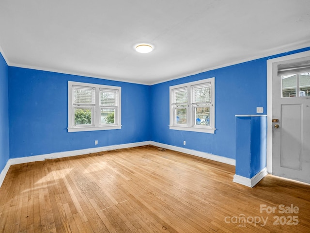 unfurnished room featuring hardwood / wood-style flooring