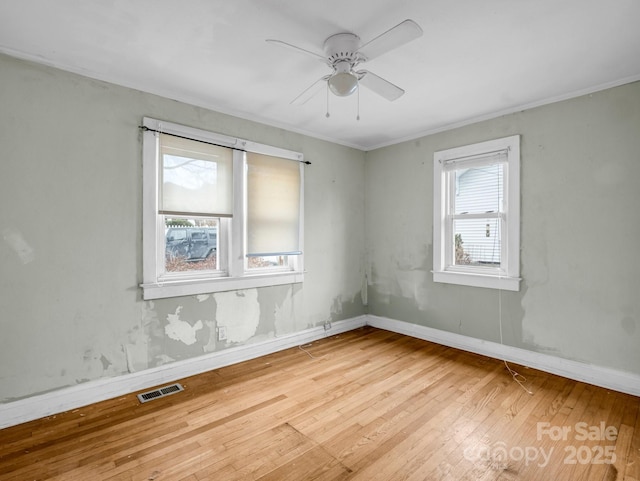 spare room with ceiling fan and light hardwood / wood-style flooring