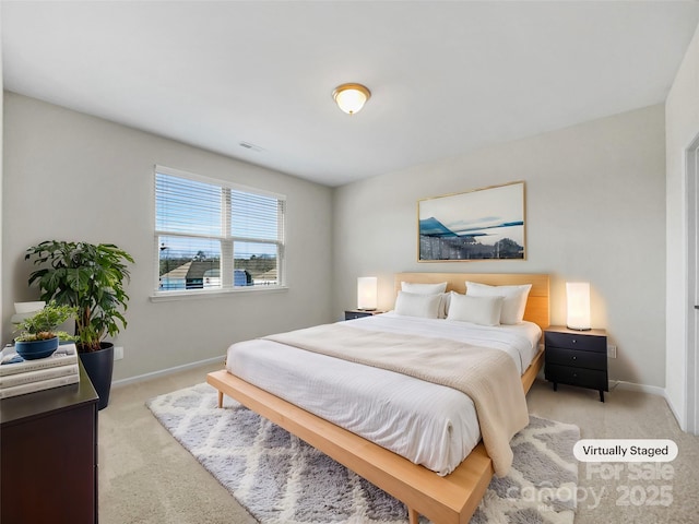 bedroom featuring light colored carpet