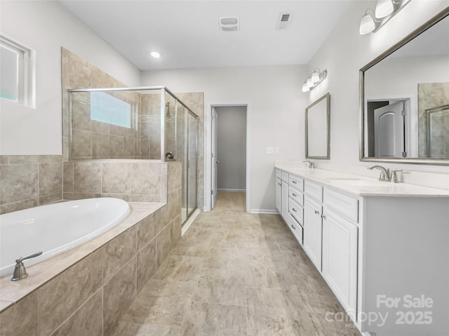 bathroom featuring independent shower and bath and vanity