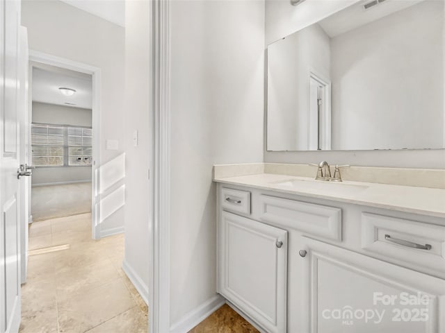 bathroom with vanity and tile patterned flooring