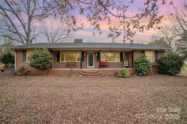 ranch-style house with covered porch