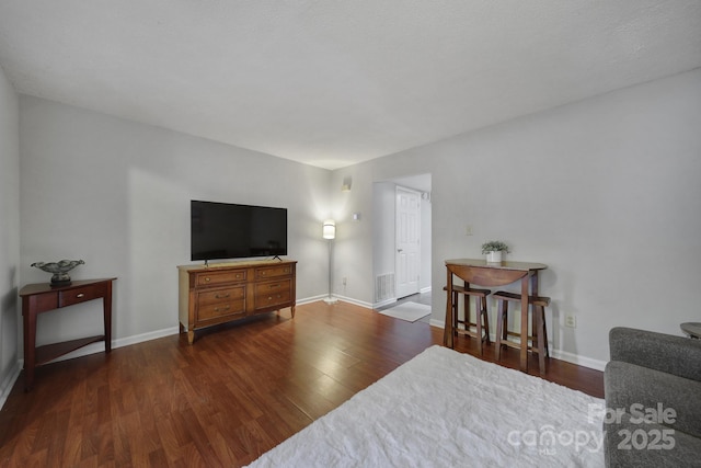 living room featuring dark hardwood / wood-style flooring