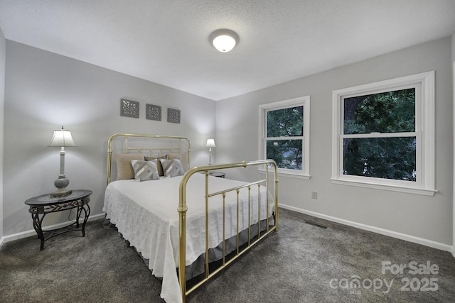 bedroom with dark carpet