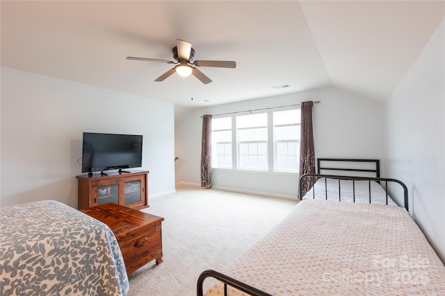 bedroom with light carpet, vaulted ceiling, and ceiling fan