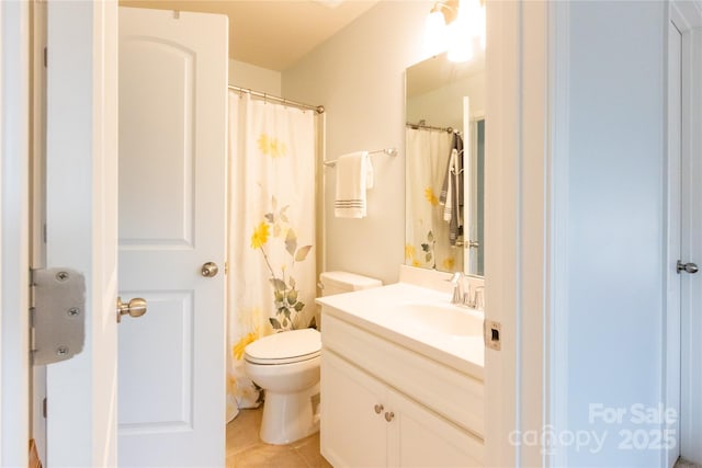 bathroom with toilet, tile patterned flooring, and vanity