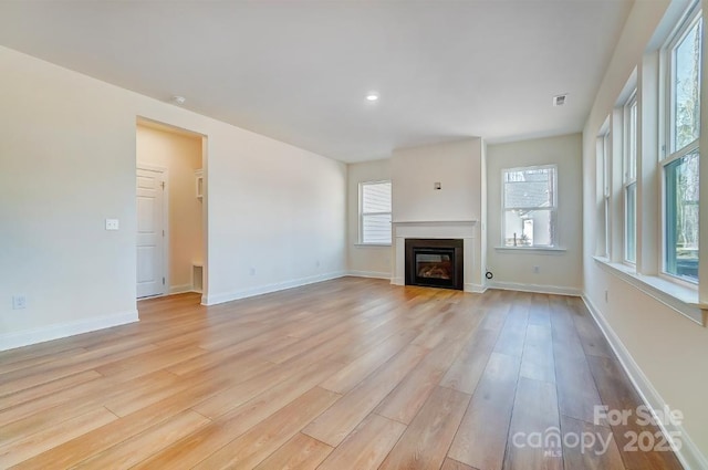 unfurnished living room with light hardwood / wood-style flooring