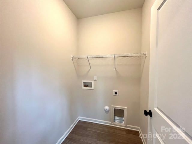 washroom featuring dark wood-type flooring, electric dryer hookup, hookup for a washing machine, and hookup for a gas dryer