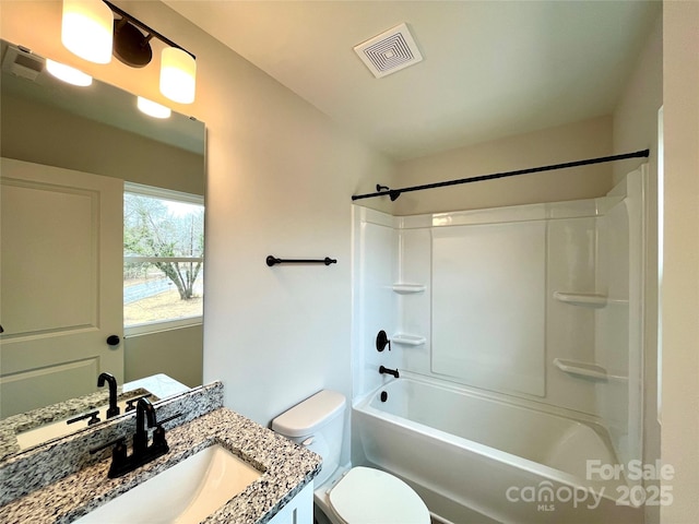 full bathroom with shower / bath combination, toilet, and vanity