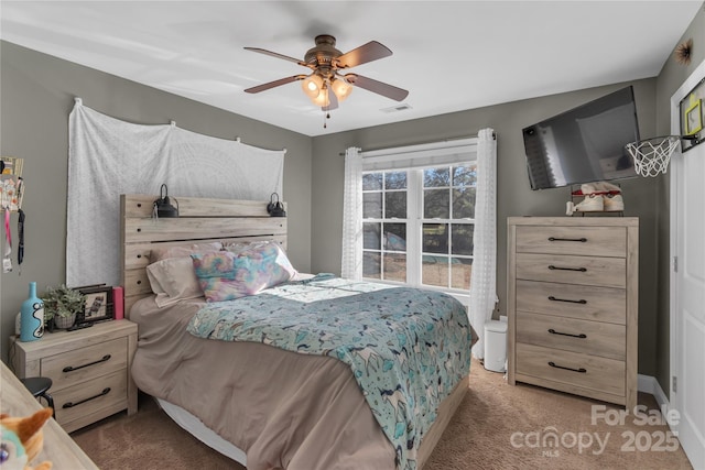 bedroom with ceiling fan and carpet floors