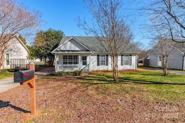 view of front of house featuring covered porch and a front yard