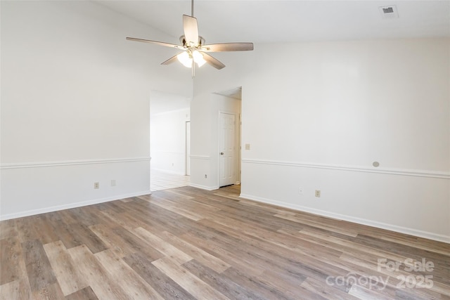 unfurnished room with light hardwood / wood-style flooring, vaulted ceiling, and ceiling fan