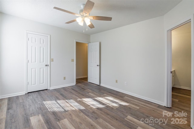 unfurnished bedroom featuring ceiling fan and wood-type flooring