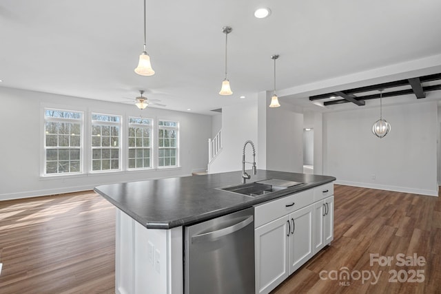 kitchen with sink, a center island with sink, stainless steel dishwasher, beam ceiling, and white cabinets