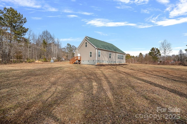 view of home's exterior with a lawn