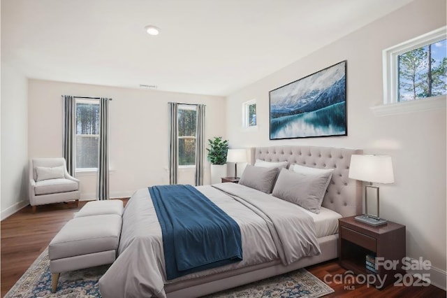 bedroom featuring dark wood-type flooring