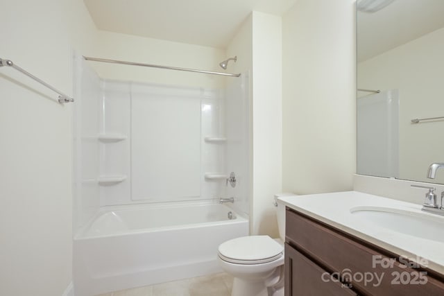 full bathroom with shower / bath combination, tile patterned floors, vanity, and toilet