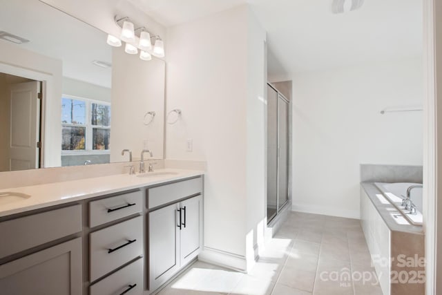 bathroom with plus walk in shower, tile patterned flooring, and vanity