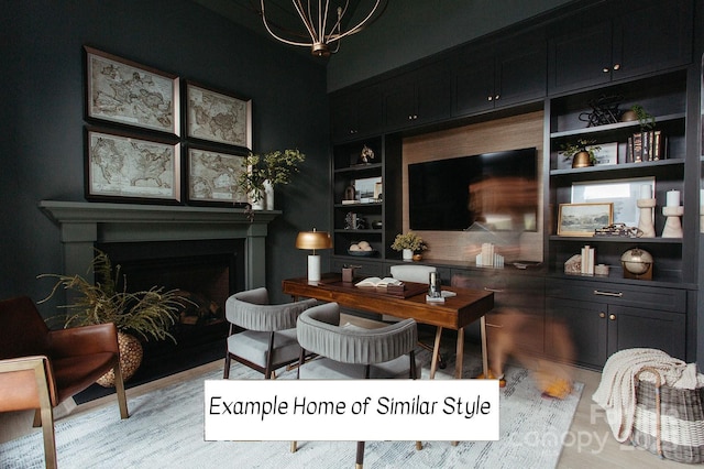 living area with an inviting chandelier and built in shelves