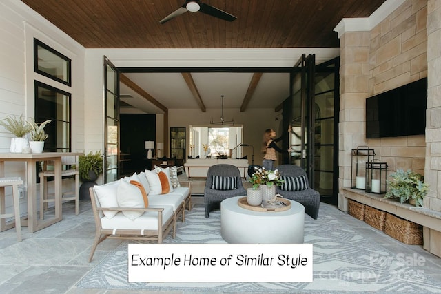 view of patio / terrace with ceiling fan, wood ceiling, and vaulted ceiling with beams