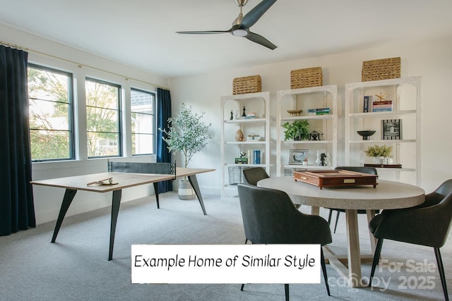 carpeted home office with ceiling fan