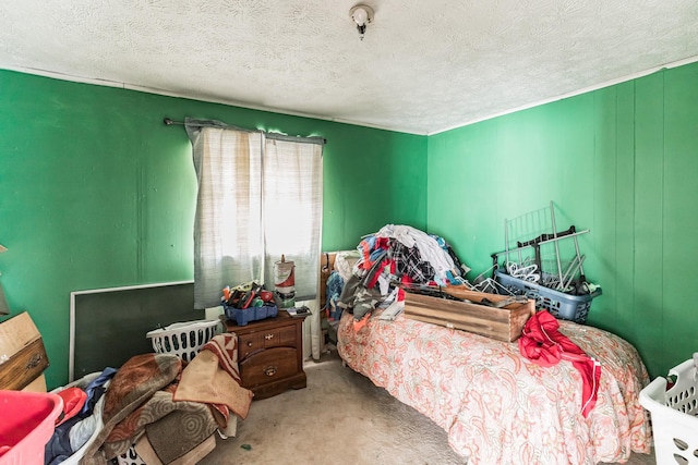 bedroom with a textured ceiling and carpet flooring