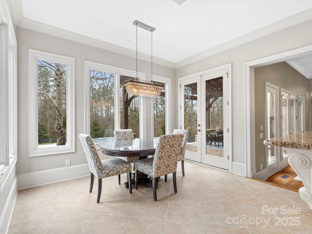 dining room with crown molding, french doors, and light tile patterned flooring