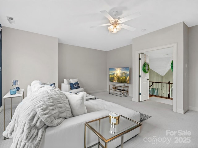 carpeted living room featuring ceiling fan