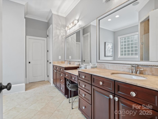 bathroom with vanity, crown molding, and tile patterned flooring