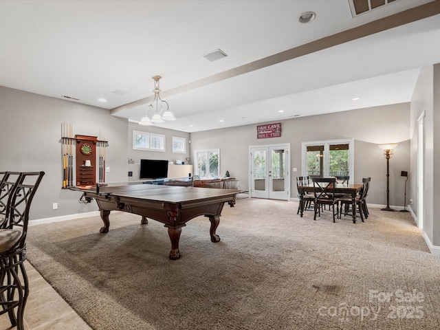 game room with light colored carpet, french doors, and an inviting chandelier